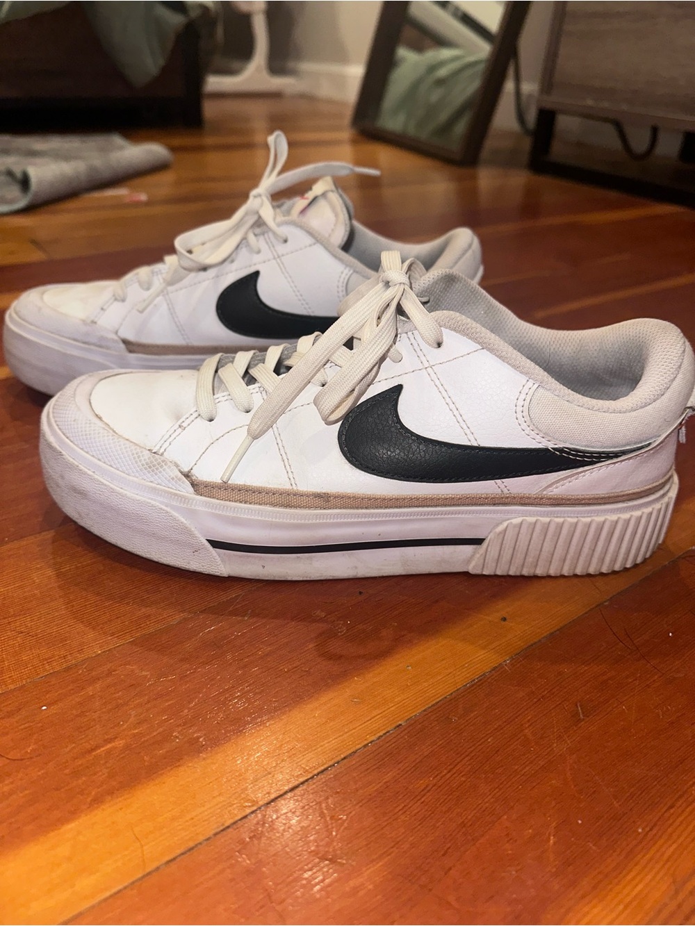 Nike White Sneakers with Black Swoosh